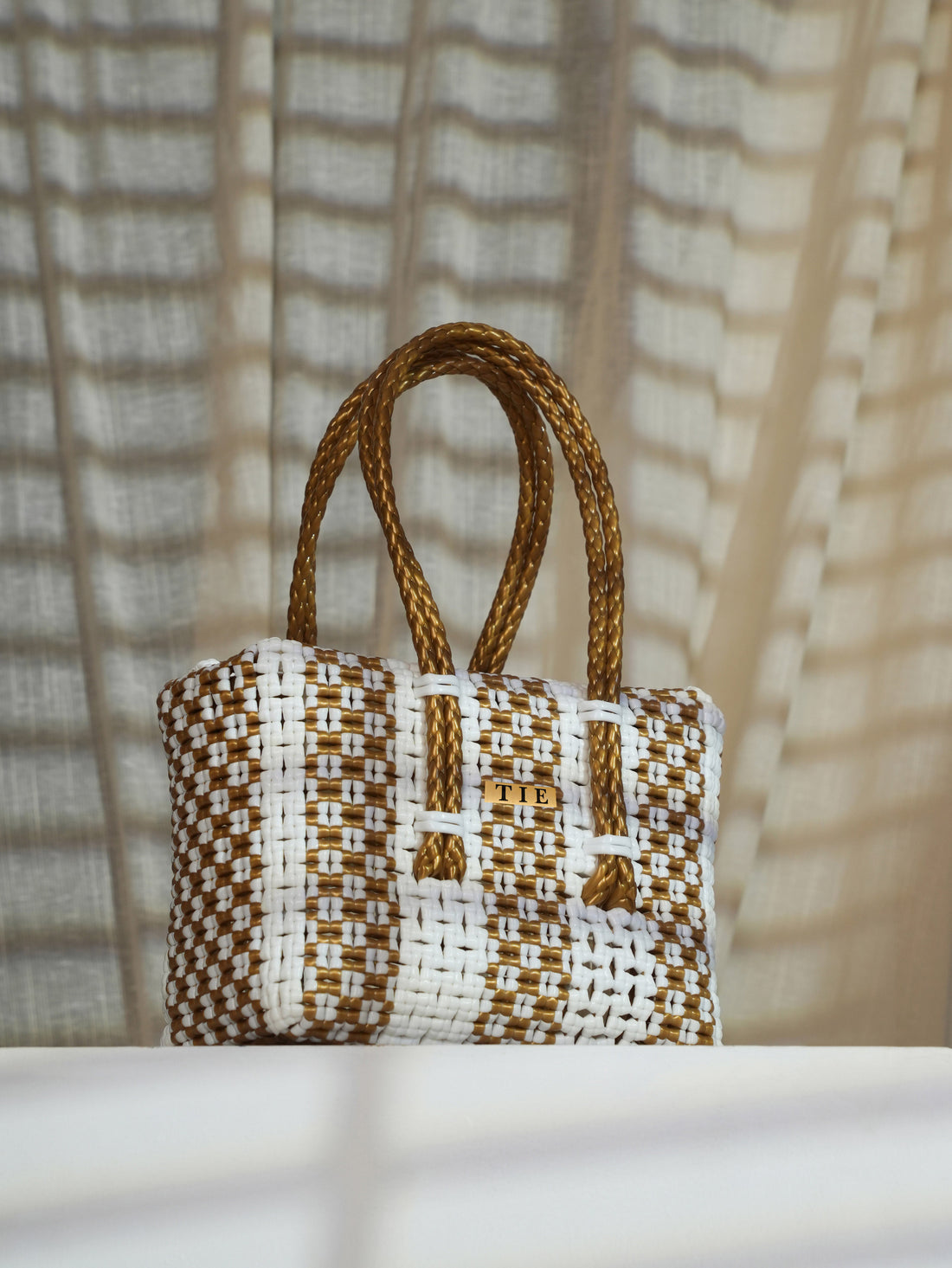Wire Basket with brown and white pattern on a neutral background | variant: White & Gold