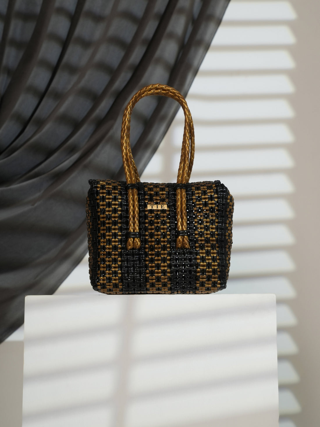 Closeweave Wire Basket - (Black & Gold) on a white surface