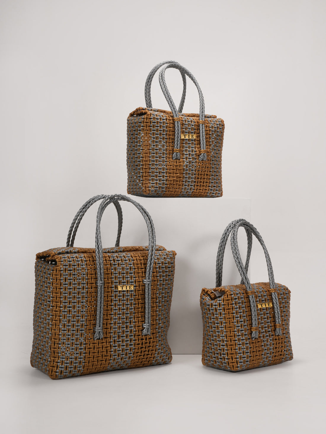 Three Closeweave Wire Basket (Gold & Silver) in a light gray background