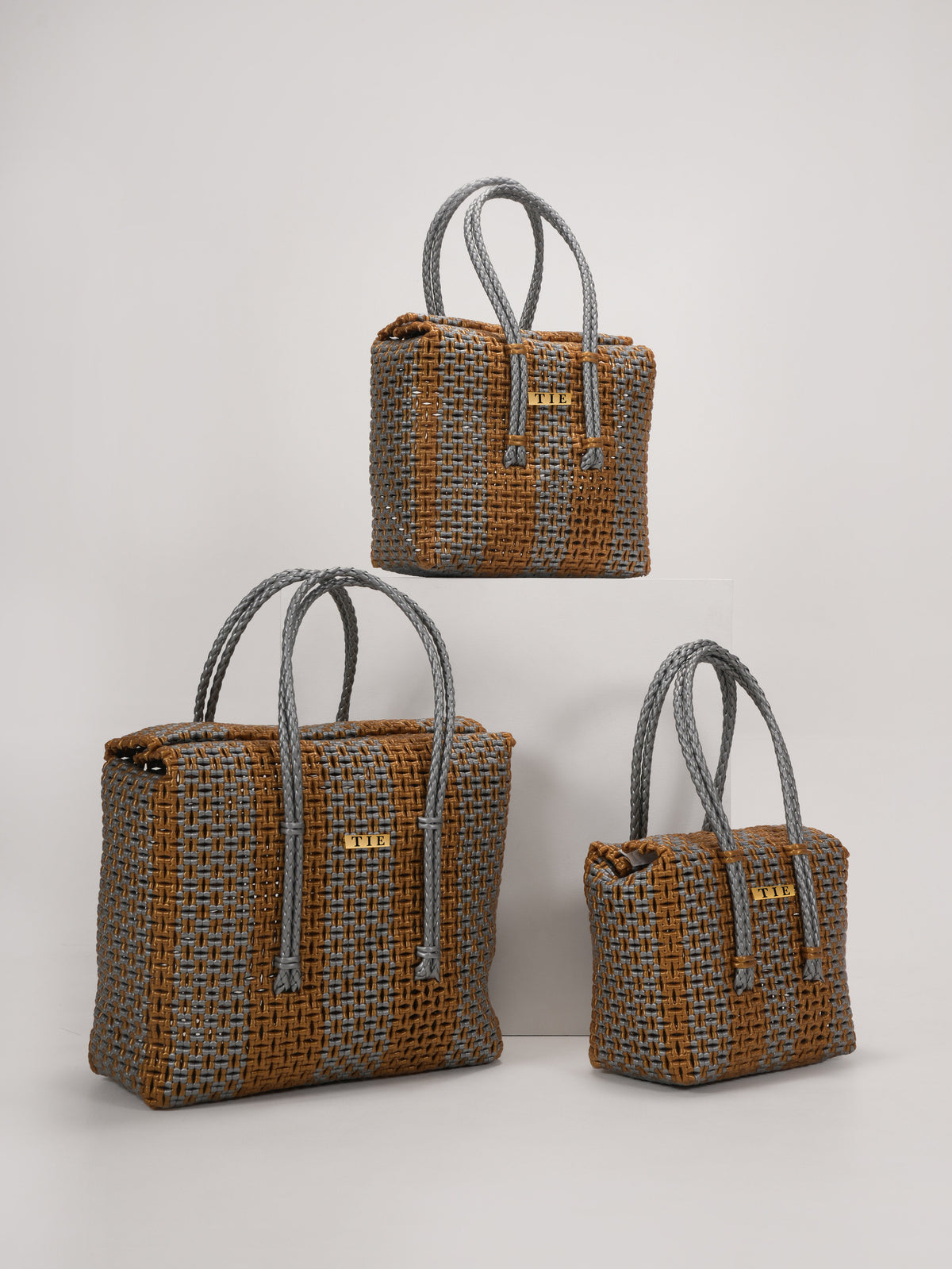 Three Closeweave Wire Basket (Gold & Silver) in a light gray background