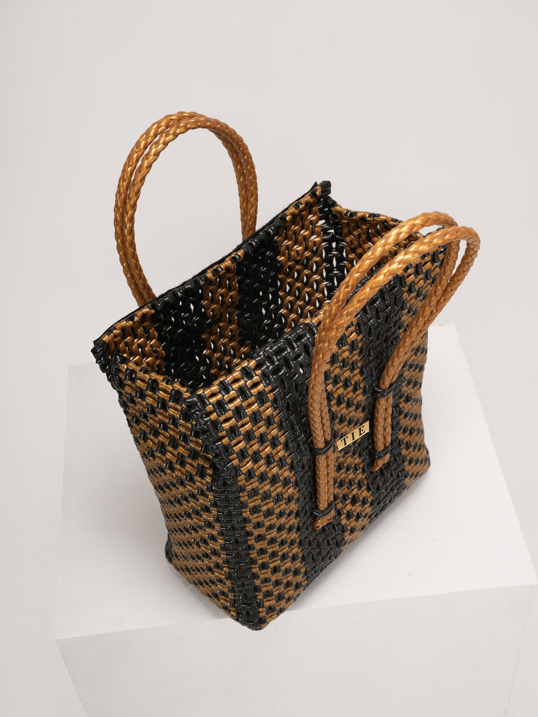 Closeweave Wire Basket with brown and black pattern on a white background
